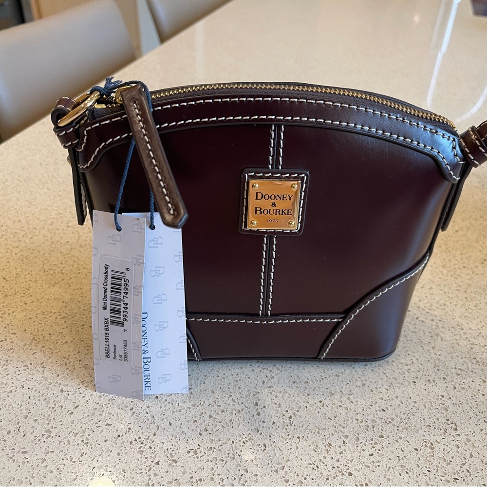 Burgundy New with tags- Dooney & Bourke Crossbody leather.